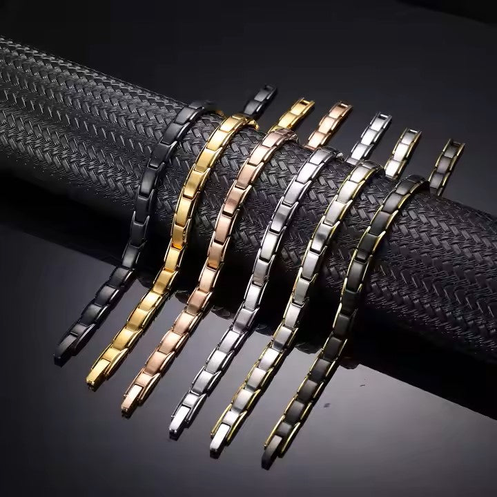 Pulsera IB magnética unisex ajustable dorada.